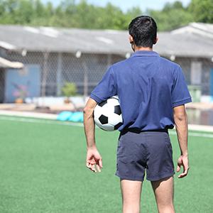 Soccer referee holding ball