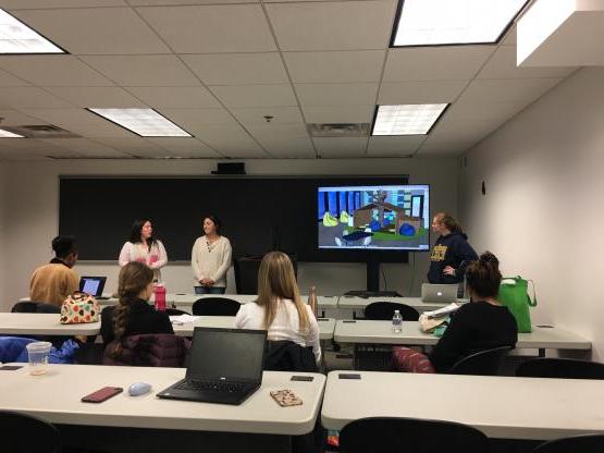 Interior architecture students present a project in class.